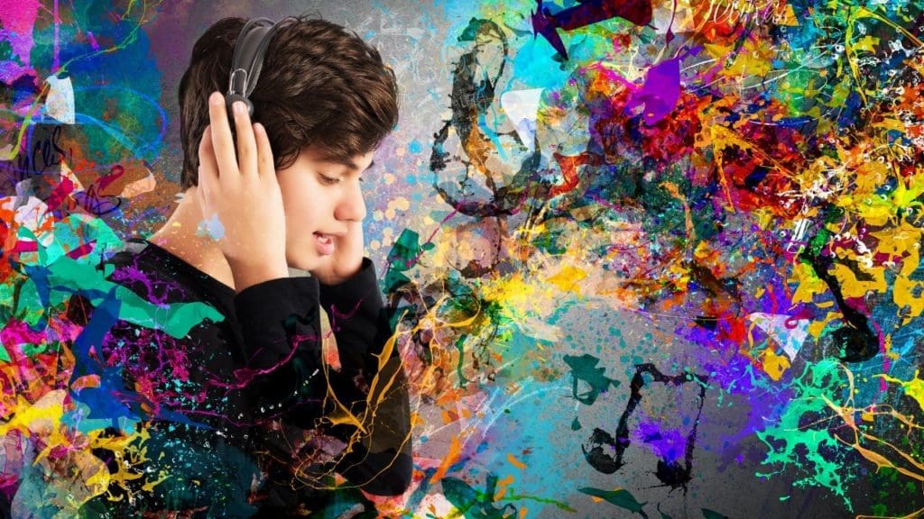 A teenager listens to music on headphones while conjuring up colorful, artistic views of the sounds they are learning.